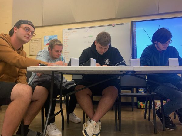 George Musgrave, AJ Moore, Liam Smith, and Andre Maguet work hard on a question.