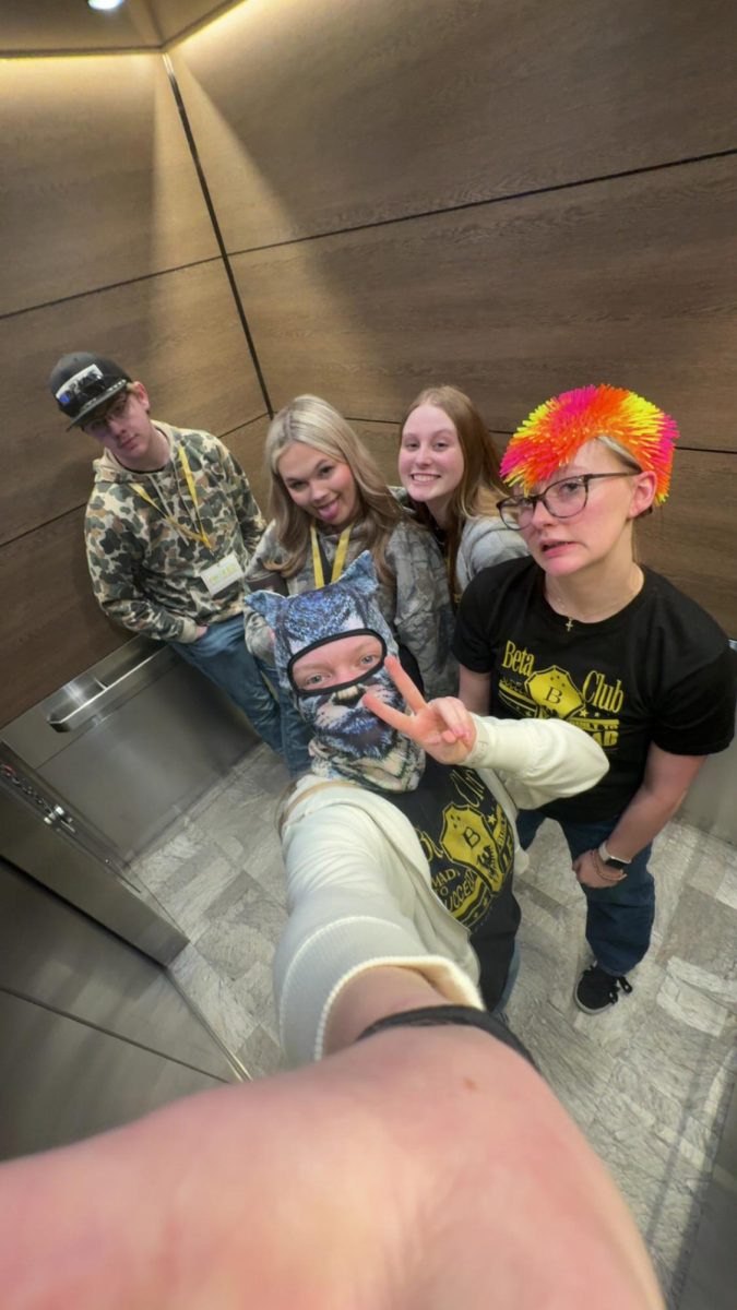 Students have a great time in the elevator at Beta Convention. 